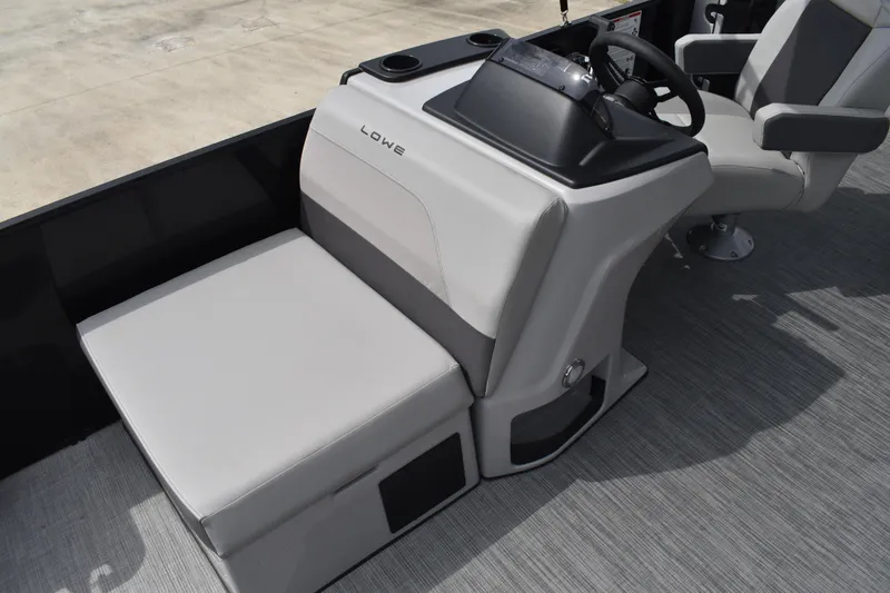 Slide: The Image of 2026 Lowe LF 214 boat interior with modern seating and steering console. - 16