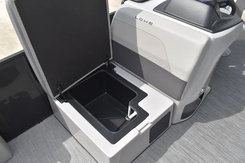 Slide: The Image of Open storage compartment in 2026 Lowe LF 214 boat, featuring sleek design and ample space. - 17