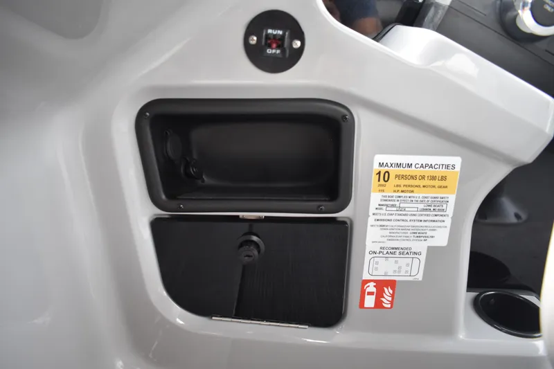 Slide: The Image of Control panel of 2026 Lowe LF 214 boat, showing capacity and safety information. - 25