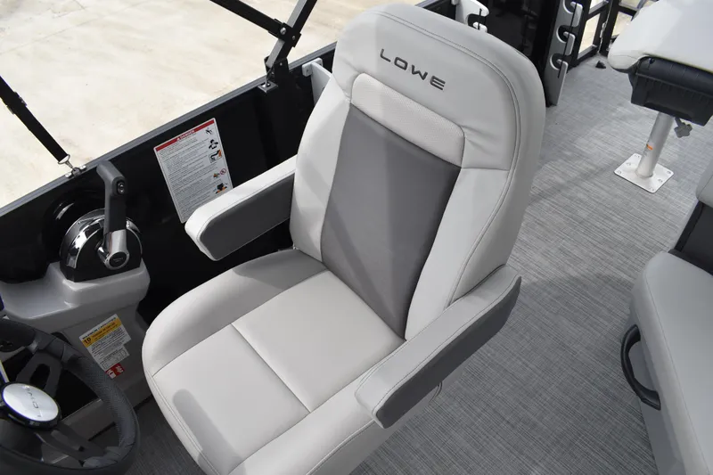 Slide: The Image of 2026 Lowe LF 214 boat interior with comfortable seating and control panel. - 26