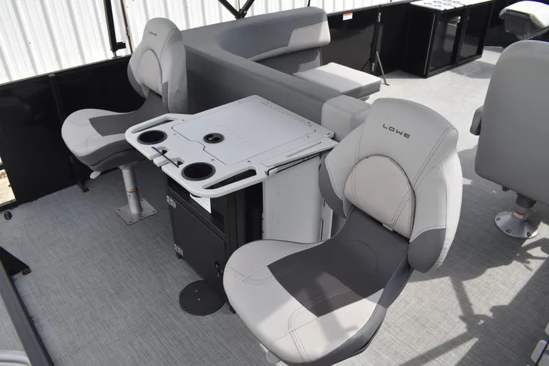 Slide: The Image of Interior of 2026 Lowe LF 214 boat with comfortable seating and table setup. - 28