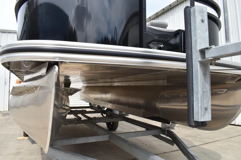 Slide: The Image of 2026 Lowe LF 214 pontoon boat on trailer, showcasing sleek aluminum pontoons. - 6