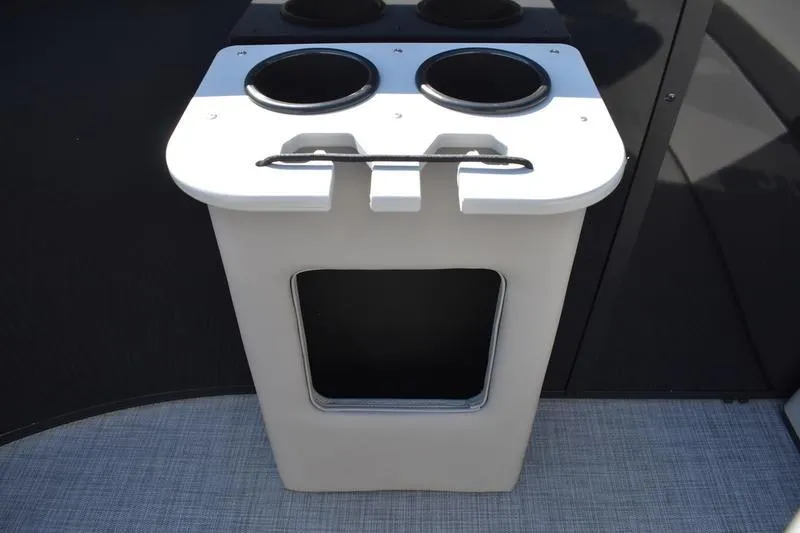 Slide: The Image of Lowe LF 214, 2026 model, black storage cabinets with white countertop and cup holder. - 17