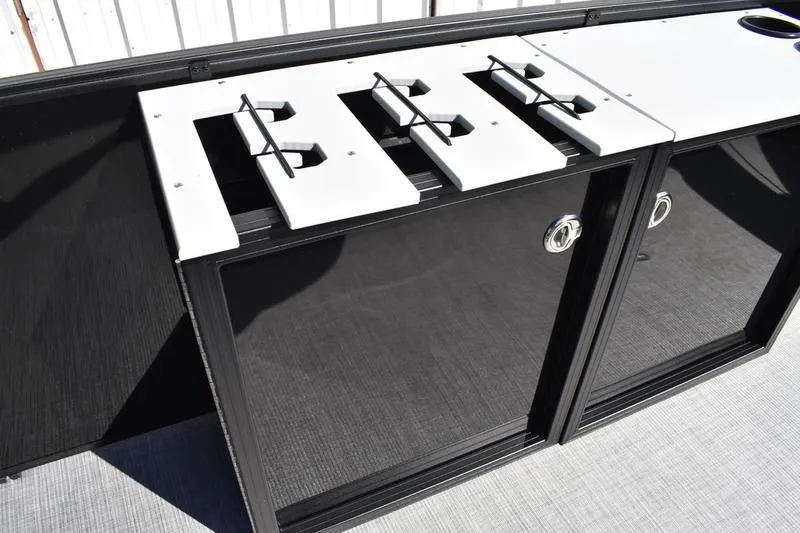 Slide: The Image of Battery compartment of 2026 Lowe LF 214 boat, featuring secure straps and wiring. - 22