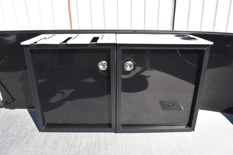 Slide: The Image of 2026 Lowe LF 214 boat interior with steering console and seating. - 24