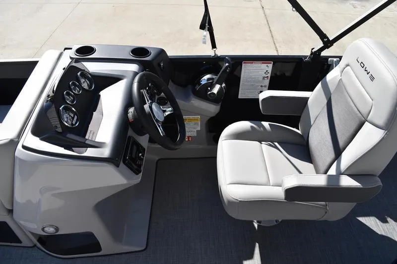 Slide: The Image of Open storage compartment in a 2026 Lowe LF 214 boat, featuring a sleek design. - 27