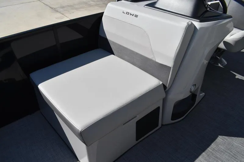 Slide: The Image of Steering console of 2026 Lowe LF 214 boat with gauges and controls. - 31