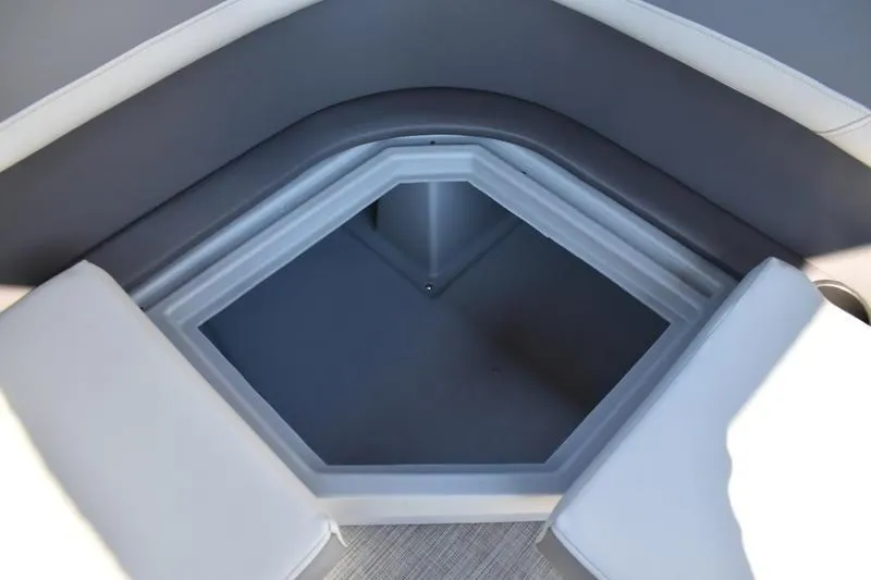 Slide: The Image of 2026 Lowe LF 214 boat interior with swivel seats and a central console. - 45