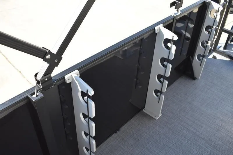 Slide: The Image of 2026 Lowe LF 214 boat console with cup holders and storage compartment. - 46