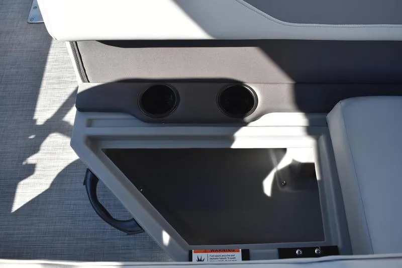 Slide: The Image of 2026 Lowe LF 214 boat console with cup holders and storage compartments. - 47
