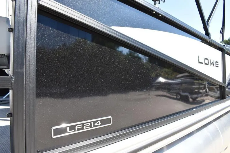 Slide: The Image of 2026 Lowe LF 214 pontoon boat rear view with ladder and trailer. - 5