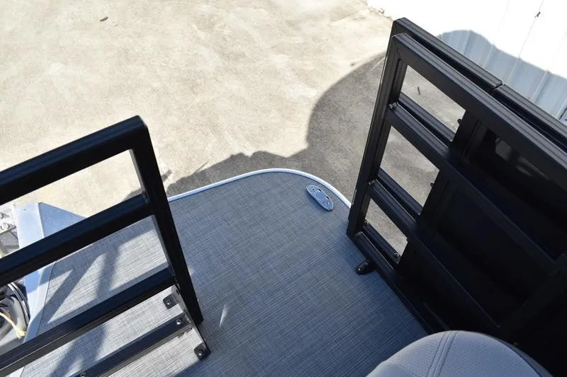 Slide: The Image of Lowe LF 214 boat deck with black metal railings, 2026 model. - 54