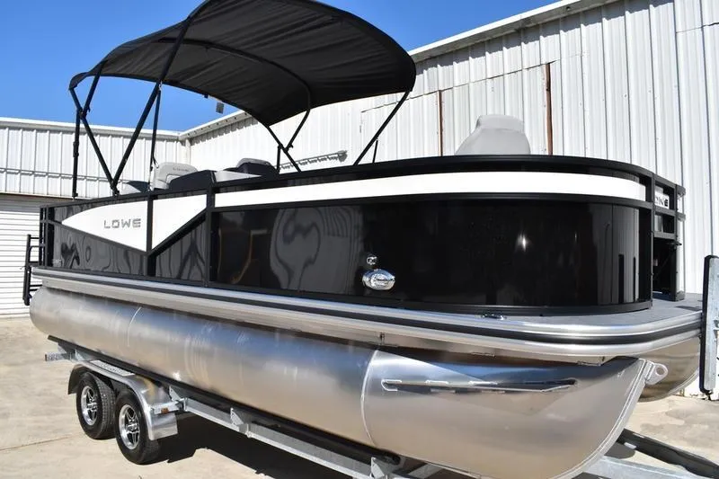 Slide: The Image of 2026 Lowe LF 214 boat trailer with ladder on concrete surface. - 6