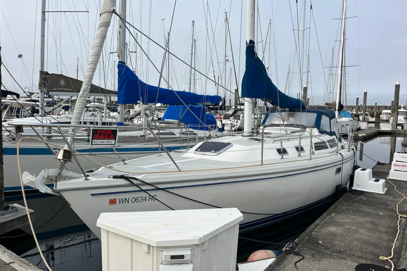 Slide: The Image of 1993 Catalina 36 sailboat for sale, docked at marina with blue covers. - 1