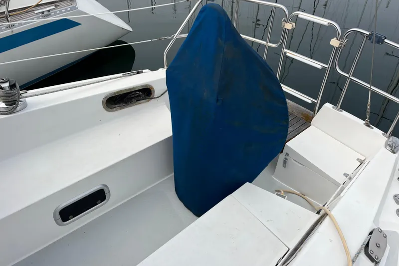 Slide: The Image of Cockpit of a 1993 Catalina 36 sailboat with a blue-covered helm. - 10