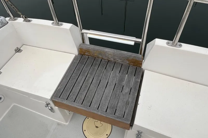 Slide: The Image of Cockpit seating area on a 1993 Catalina 36 sailboat with wooden slats. - 16