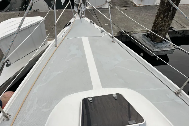 Slide: The Image of Deck of a 1993 Catalina 36 sailboat docked at a marina. - 5