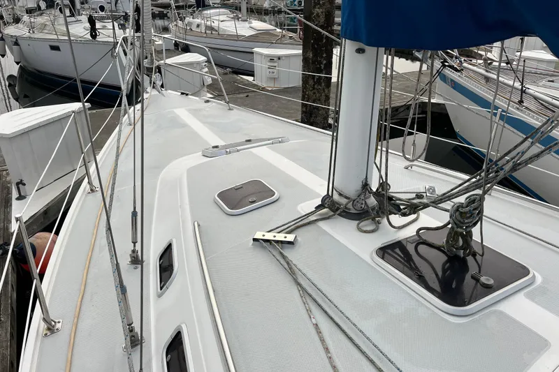Slide: The Image of 1993 Catalina 36 sailboat deck with rigging, docked at marina. - 6