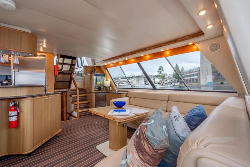 Slide: The Image of Luxurious interior of 2000 Bayliner 4788 Pilot House Motoryacht with plush seating and modern amenities. - 13