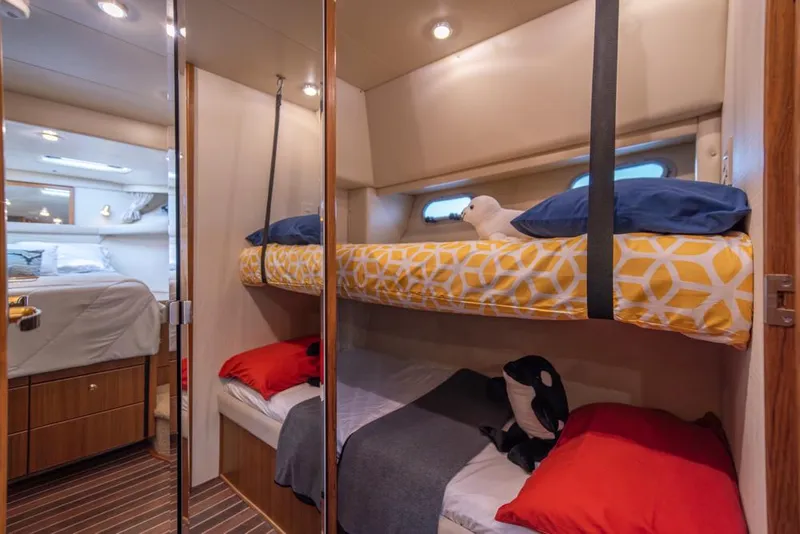 Slide: The Image of Cozy bunk beds in 2000 Bayliner 4788 Pilot House Motoryacht cabin interior. - 32