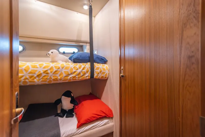 Slide: The Image of Cozy bunk beds in 2000 Bayliner 4788 Pilot House Motoryacht cabin. - 34
