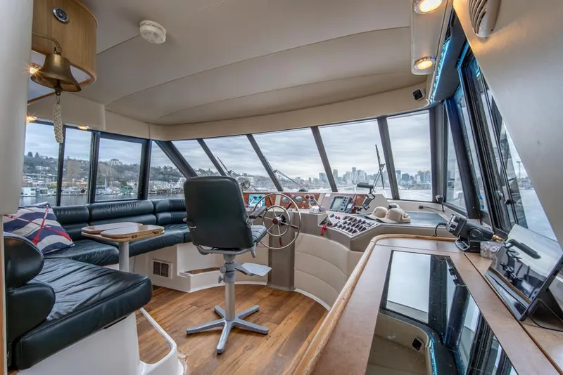 Slide: The Image of Interior of 2000 Bayliner 4788 Pilot House Motoryacht with panoramic windows and modern helm. - 35