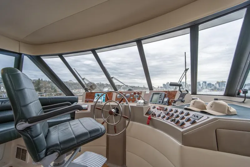 Slide: The Image of Interior of 2000 Bayliner 4788 Pilot House Motoryacht with steering wheel and control panel. - 37