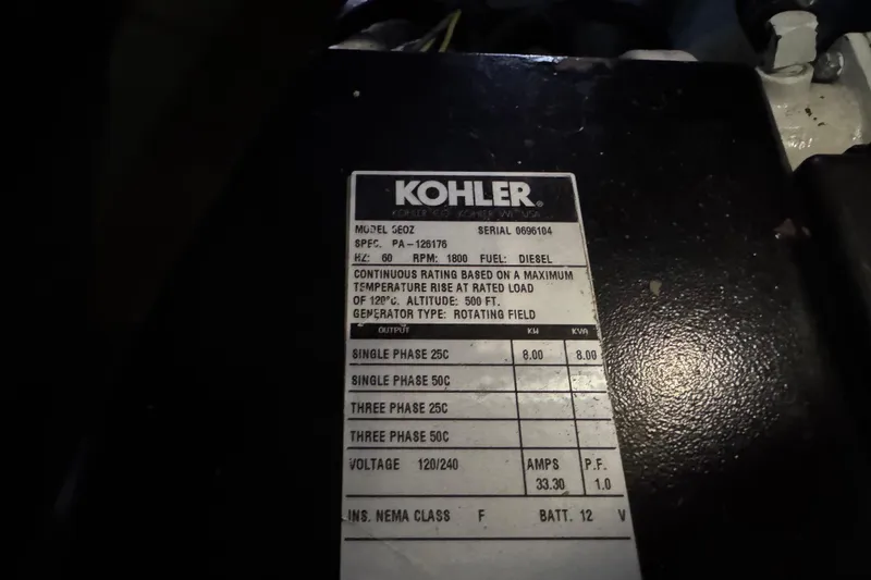 Slide: The Image of Kohler generator label on 2002 Silverton 352 Motor Yacht, detailing specifications and ratings. - 100