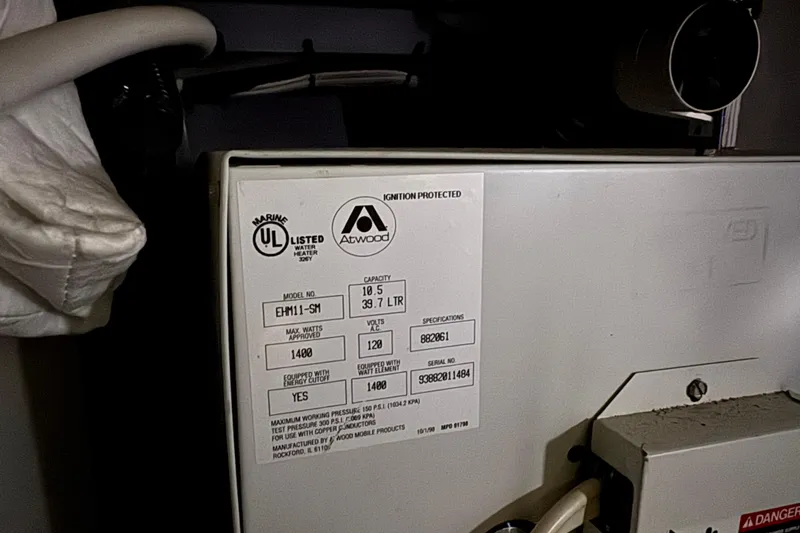 Slide: The Image of 2002 Silverton 352 Motor Yacht water heater label, Atwood model EHM11-SM, 10.5-gallon capacity. - 104