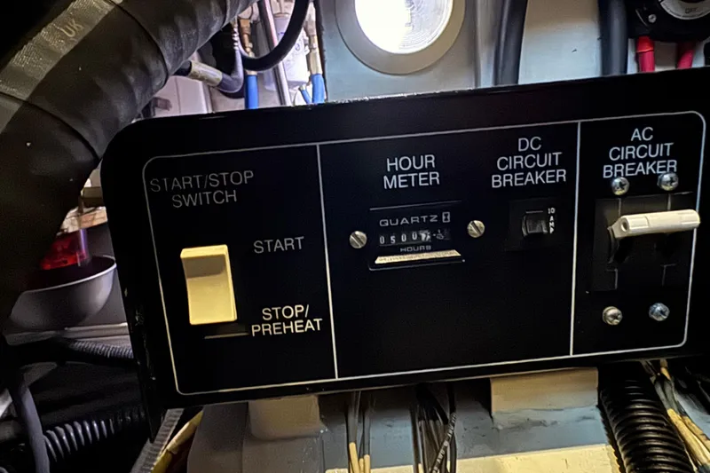 Slide: The Image of Control panel of a 2002 Silverton 352 Motor Yacht with hour meter and circuit breakers. - 106