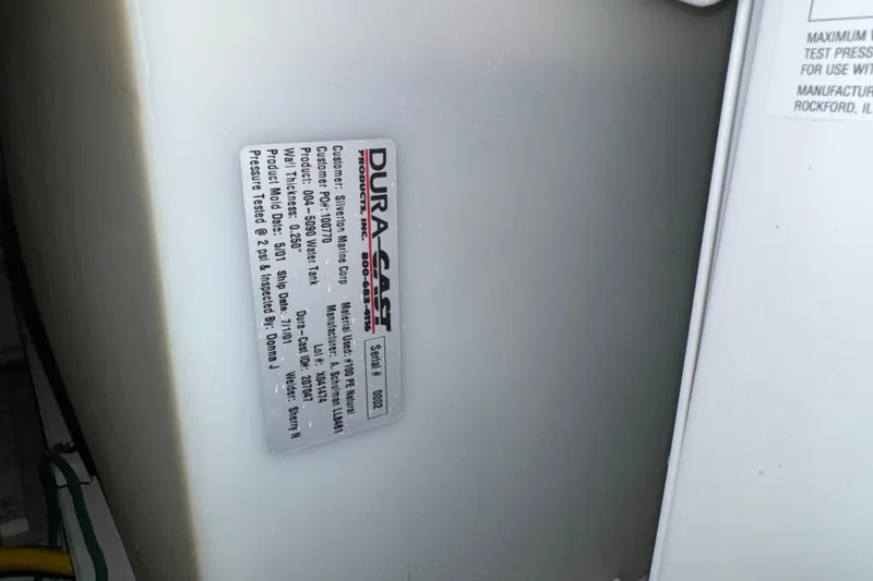 Slide: The Image of 2002 Silverton 352 Motor Yacht water tank label, Dura-Cast product details visible. - 107