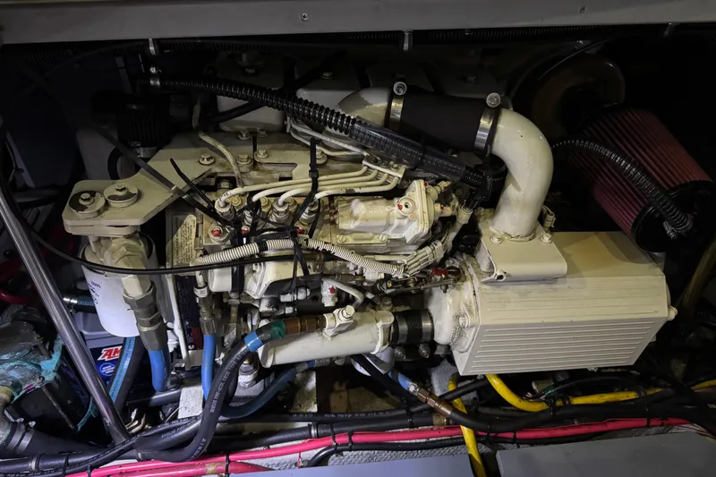 Slide: The Image of Engine compartment of a 2002 Silverton 352 Motor Yacht, showcasing detailed mechanical components. - 109
