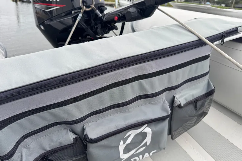 Slide: The Image of Storage compartment on a 2002 Silverton 352 Motor Yacht with outboard motor in background. - 11