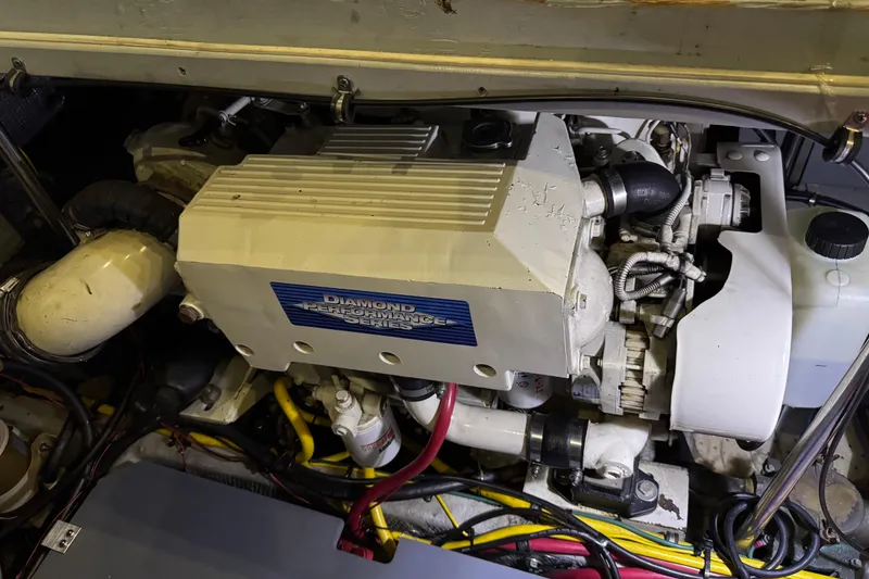 Slide: The Image of Engine compartment of a 2002 Silverton 352 Motor Yacht, featuring a Diamond Performance Series engine. - 110