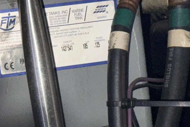 Slide: The Image of Close-up of a marine fuel tank label on a 2002 Silverton 352 Motor Yacht. - 114
