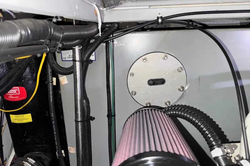 Slide: The Image of Engine room of a 2002 Silverton 352 Motor Yacht, featuring wiring and components. - 115