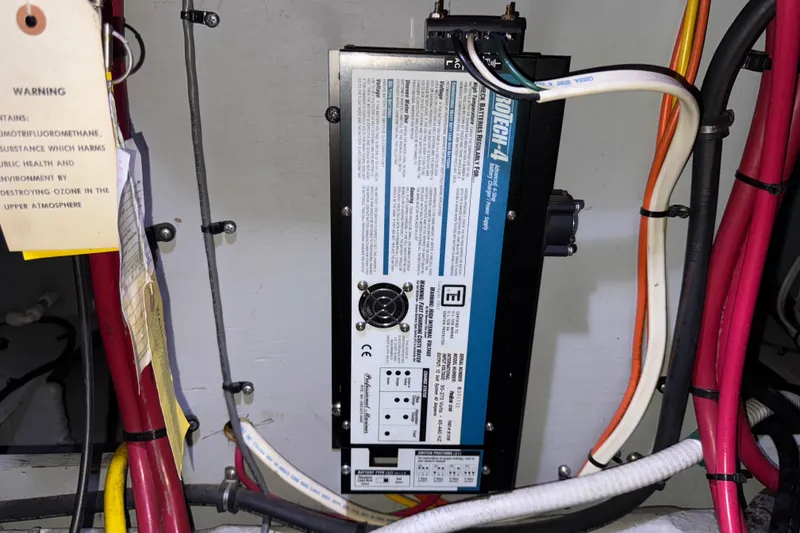 Slide: The Image of Electrical panel with wiring in a 2002 Silverton 352 Motor Yacht. - 116