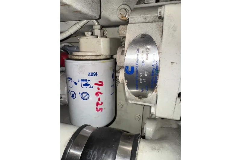 Slide: The Image of Engine component of 2002 Silverton 352 Motor Yacht, featuring a Cummins filter. - 118