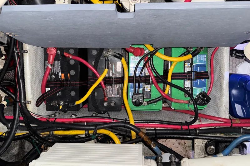 Slide: The Image of Battery compartment of a 2002 Silverton 352 Motor Yacht with wiring and connections. - 120