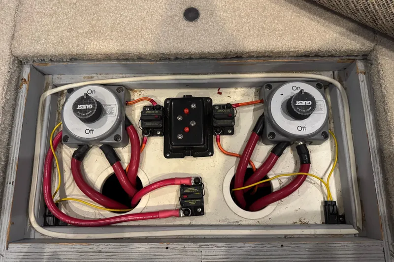 Slide: The Image of Electrical panel of a 2002 Silverton 352 Motor Yacht with battery switches and wiring. - 121