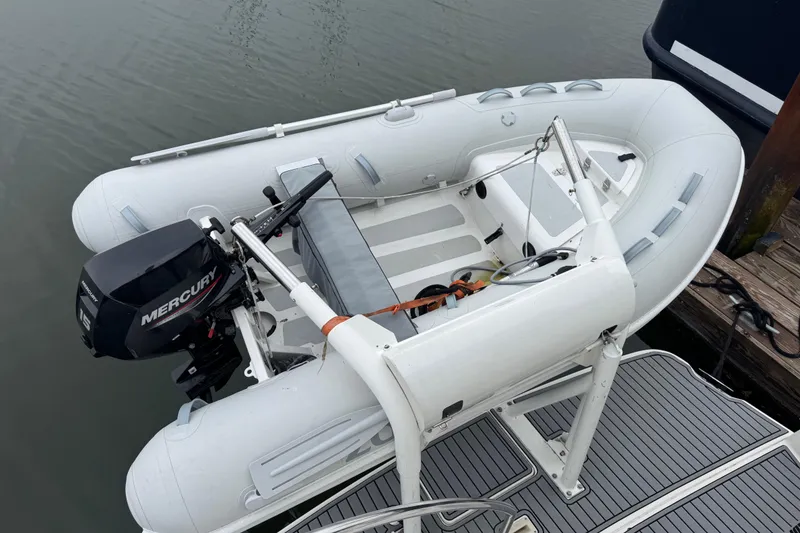 Slide: The Image of Inflatable boat with Mercury outboard motor on Silverton 352 Motor Yacht, 2002 model. - 13