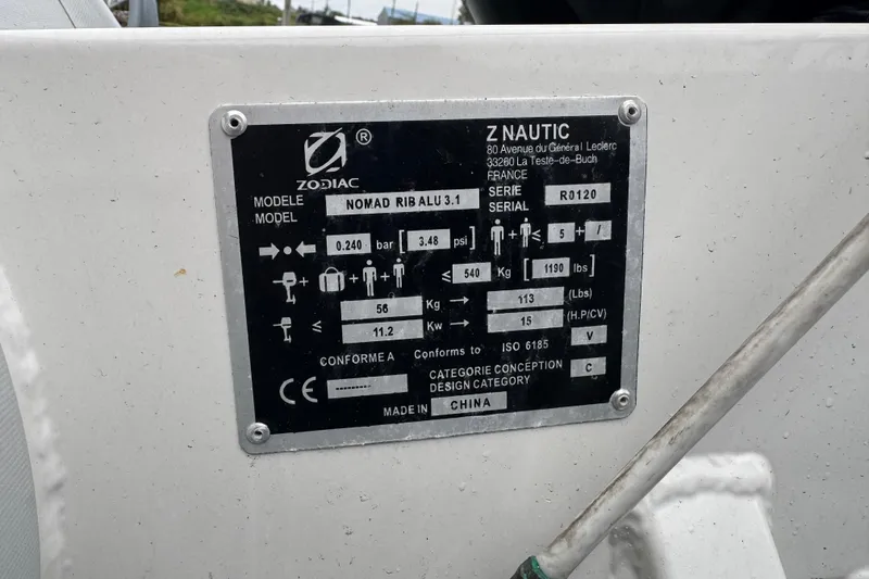 Slide: The Image of Zodiac Nomad RIB ALU 3.1 specifications plate on a 2002 Silverton 352 Motor Yacht. - 14