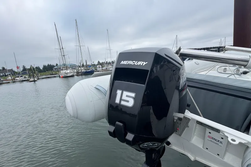Slide: The Image of Mercury 15 outboard motor on 2002 Silverton 352 Motor Yacht at marina. - 16