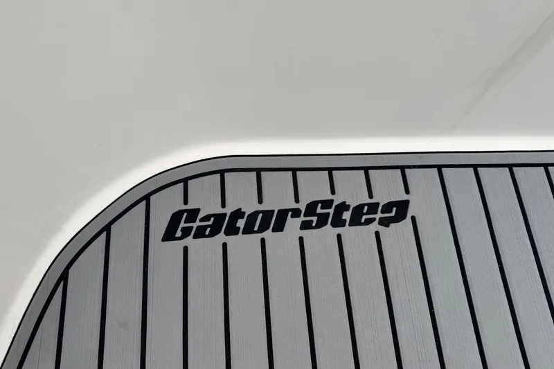 Slide: The Image of GatorStep flooring on 2002 Silverton 352 Motor Yacht, featuring sleek, striped design. - 18
