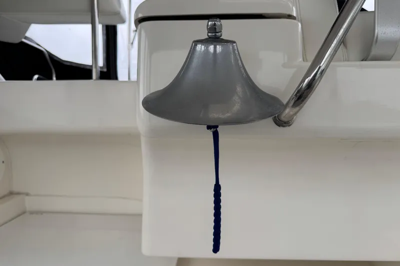Slide: The Image of Silverton 352 Motor Yacht 2002 bell with blue rope pull on white background. - 20
