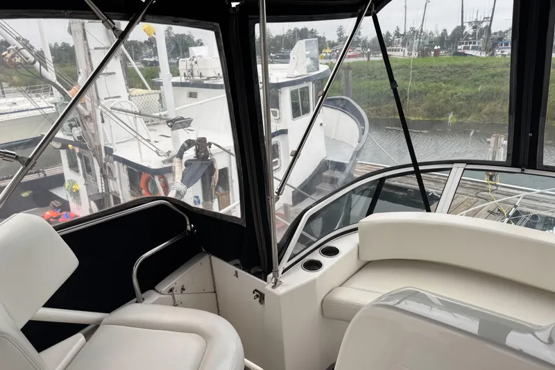 Slide: The Image of 2002 Silverton 352 Motor Yacht interior with marina view. - 23
