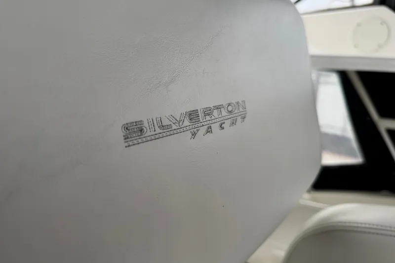 Slide: The Image of Close-up of Silverton 352 Motor Yacht seat, showcasing logo detail. - 25