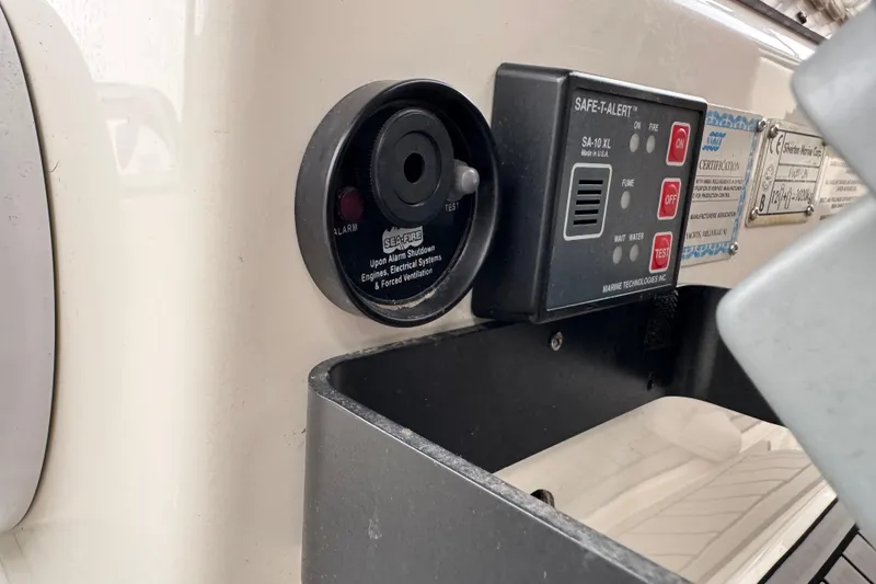 Slide: The Image of Control panel on a 2002 Silverton 352 Motor Yacht, featuring safety alert systems. - 31