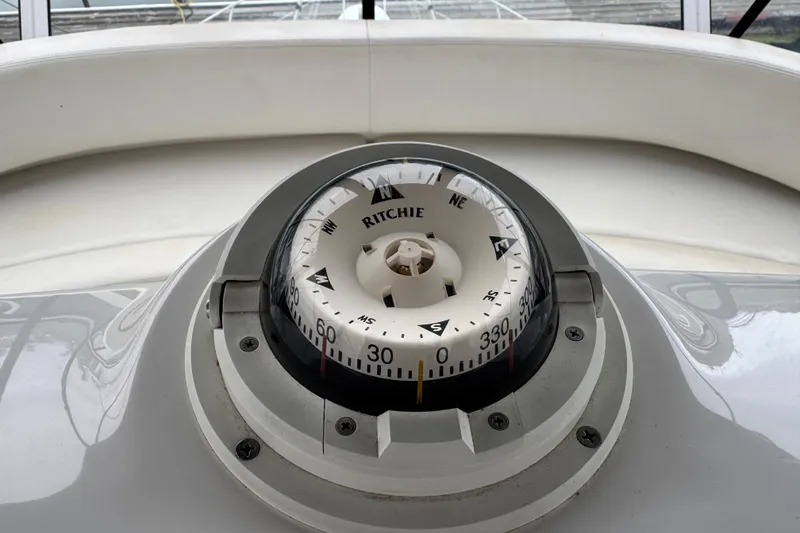 Slide: The Image of Compass on 2002 Silverton 352 Motor Yacht dashboard, displaying navigational directions. - 37