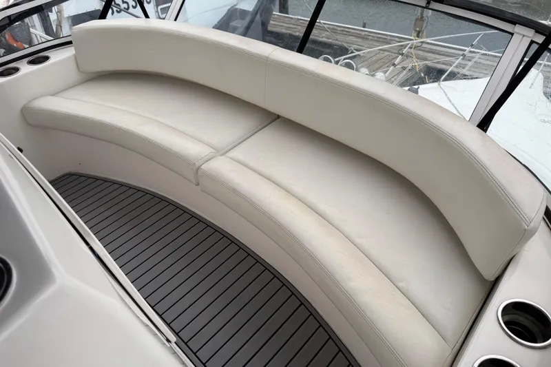 Slide: The Image of Luxurious seating on 2002 Silverton 352 Motor Yacht, featuring sleek white upholstery. - 44